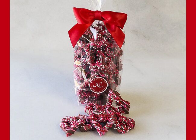 This is a picture of Chocolate Covered Heart-Shaped Pretzels, offered by Fromagination.