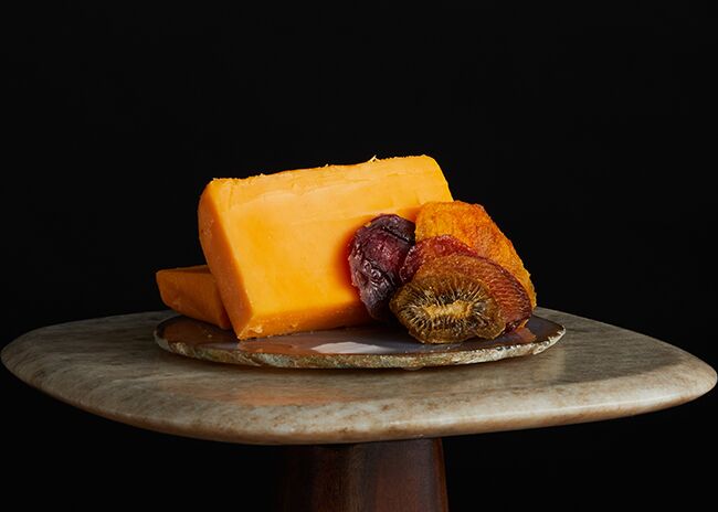 This is a picture of Hook's Five-Year Aged Cheddar cheese, offered by Fromagination.
