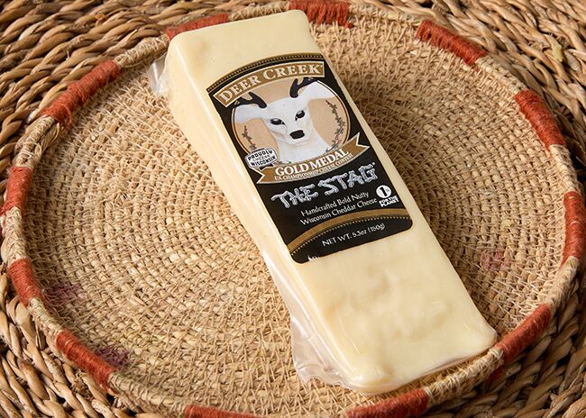 This is a picture of The Stag Cheddar cheese, featured by Fromagination.