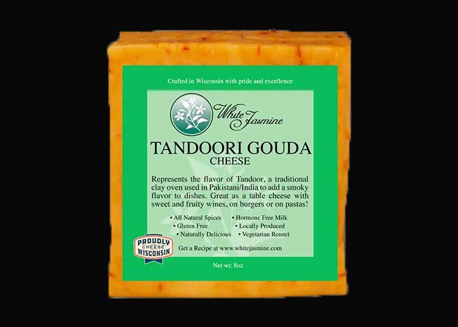 This is a picture of White Jasmine Tandoori Gouda cheese, offered by Fromagination.
