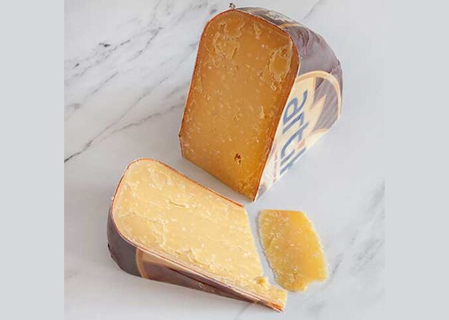 This is a picture of Vintage Lot 36 Gouda cheese, offered by Fromagination.